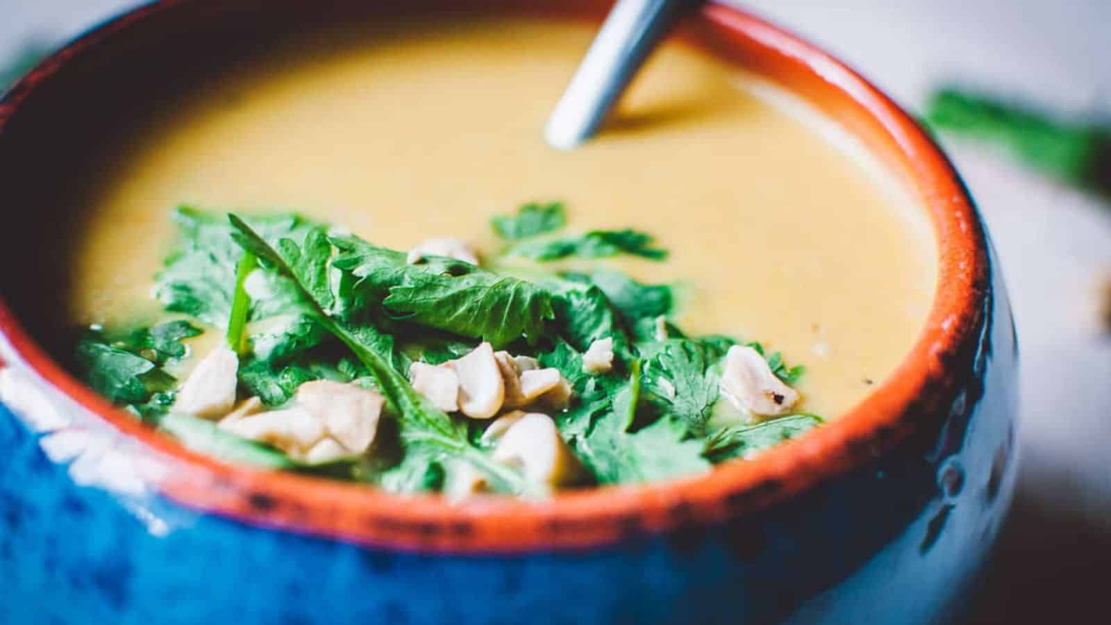 A creamy bowl of vegan cashew carrot ginger soup.