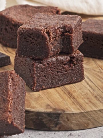 Vegan Chocolate Butter Mochi on a brown cutting board.