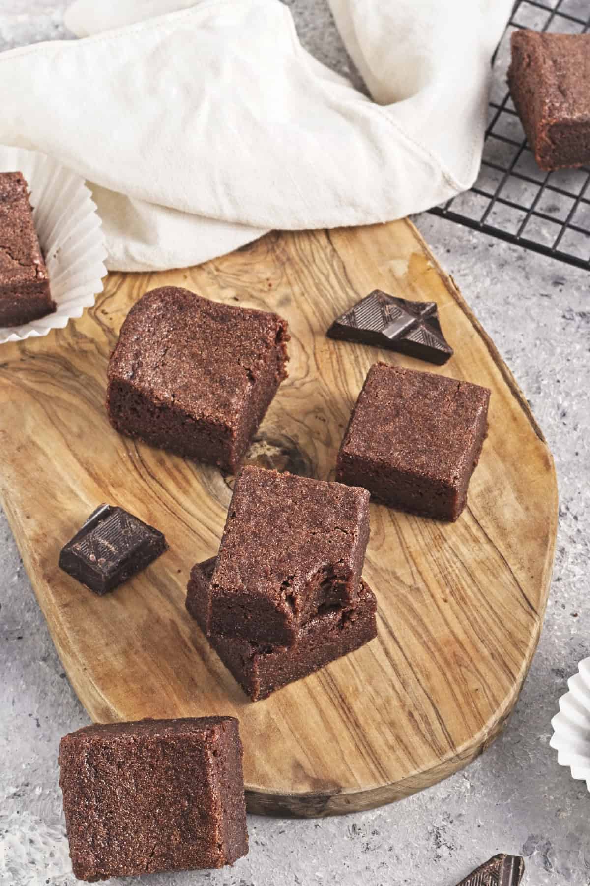Vegan Chocolate Butter Mochi on a brown cutting board.