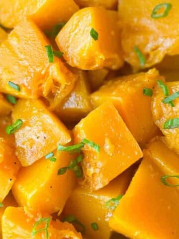 Pumpkin stir fry in a white bowl.