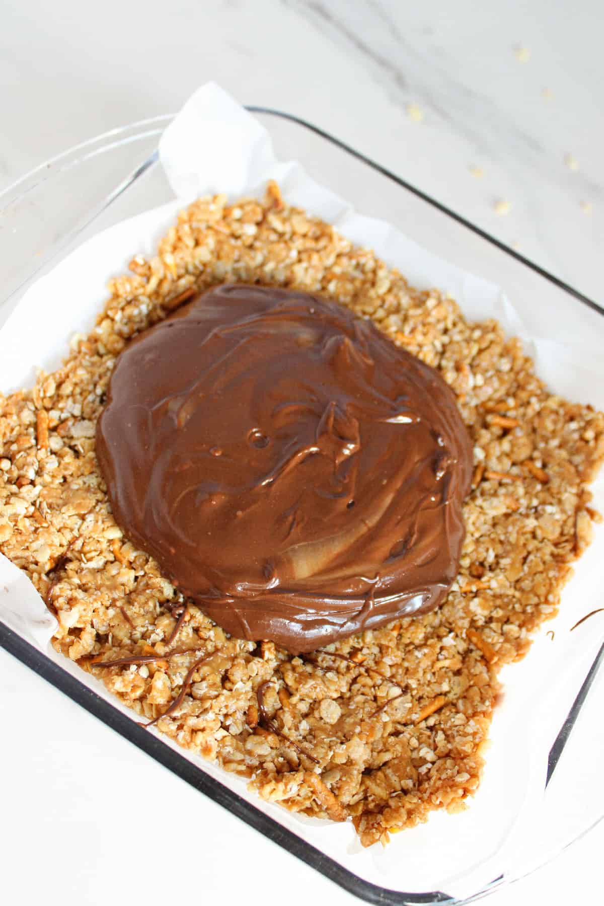 Smooth melted chocolate peanut butter mixture spread over the cereal base.
