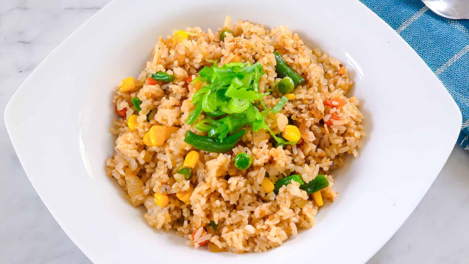 A simple frozen vegetable fried rice served warm and packed with colorful veggies.
