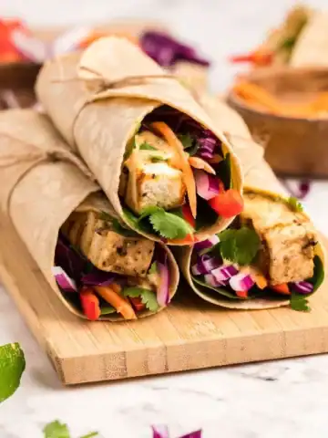 Thai tofu wraps served with a creamy coconut almond butter dipping sauce.