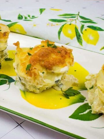 Au Gratin Potato Stacks on a white plate.