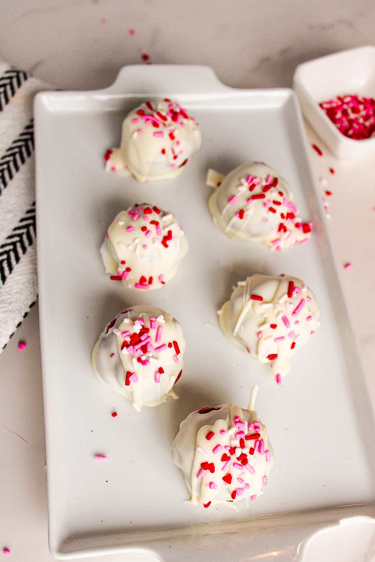 White chocolate red velvet truffles cooling before serving.