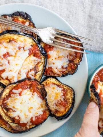 Breaded eggplant slices baked with cheese.