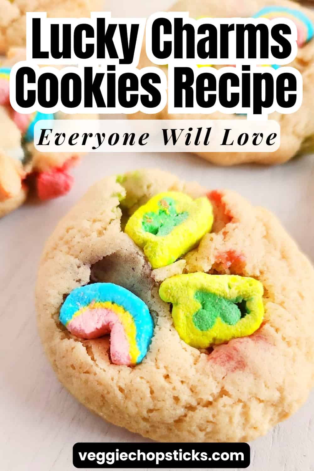Lucky Charms cookies with colorful marshmallow pieces on a white plate.