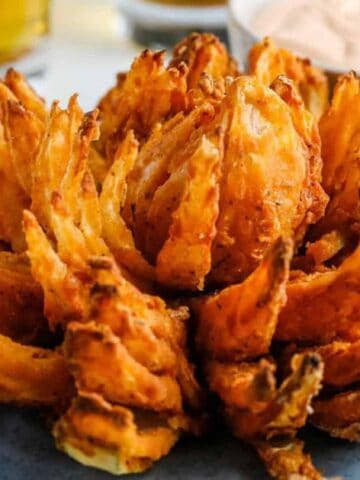 Air Fryer Blooming Onion on a blue plate.