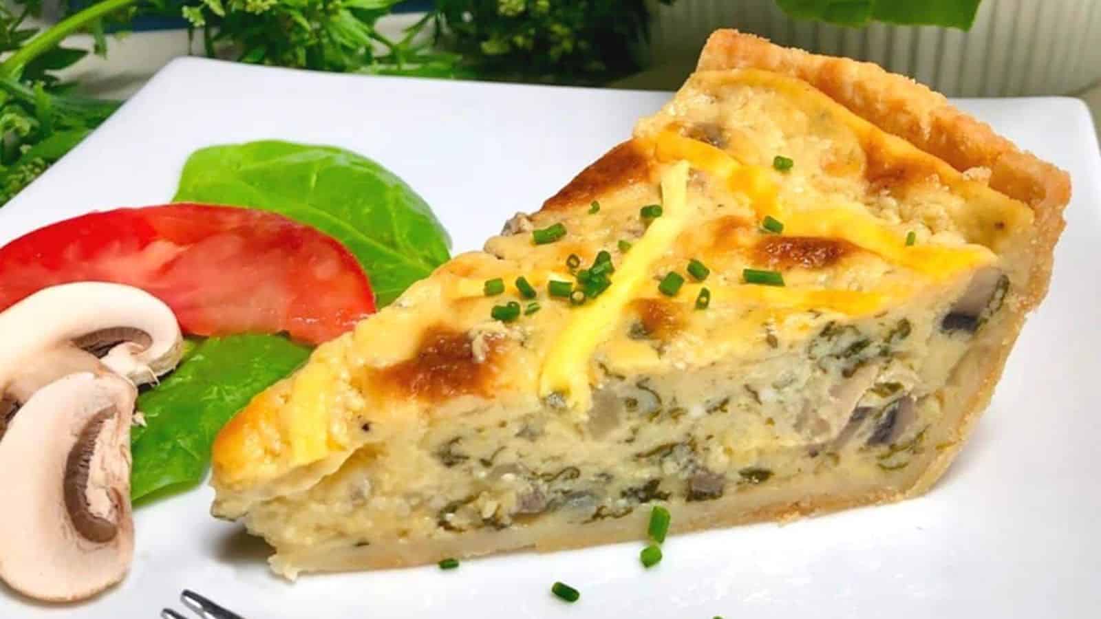 Vegan spinach mushroom quiche baked with a rich vegetable filling in a golden crust.