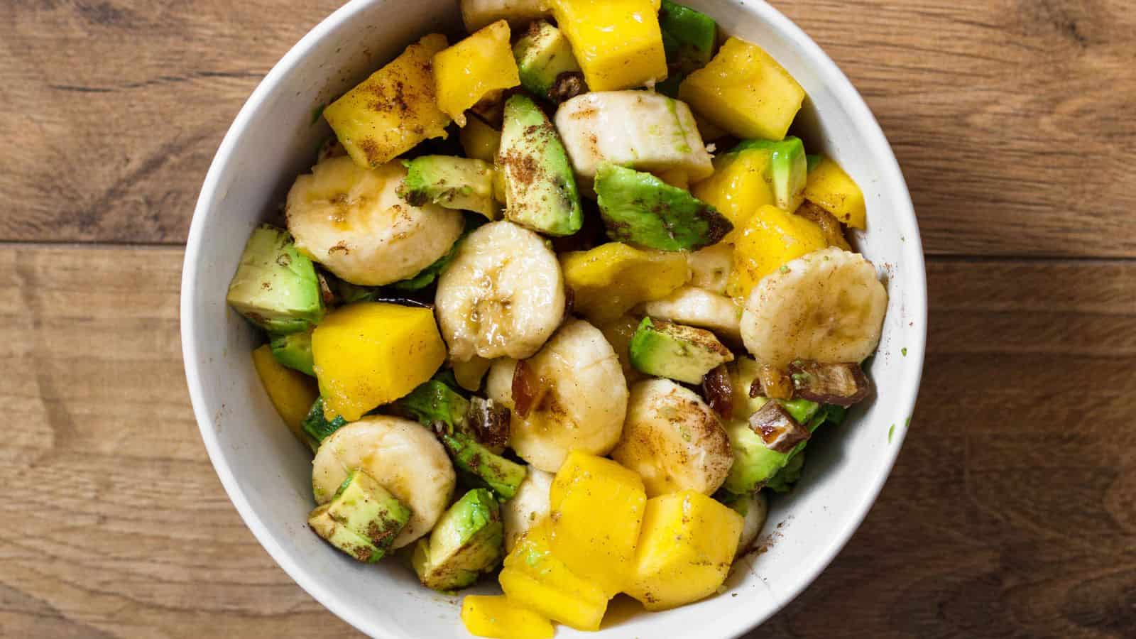 Tropical fruit salad with colorful fresh fruit pieces tossed in a light mix.