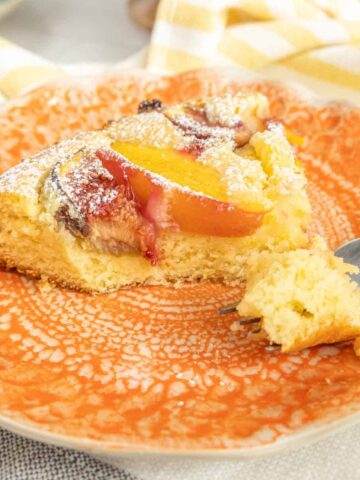 Lemon Fig Cake with Nectarine on a plate.