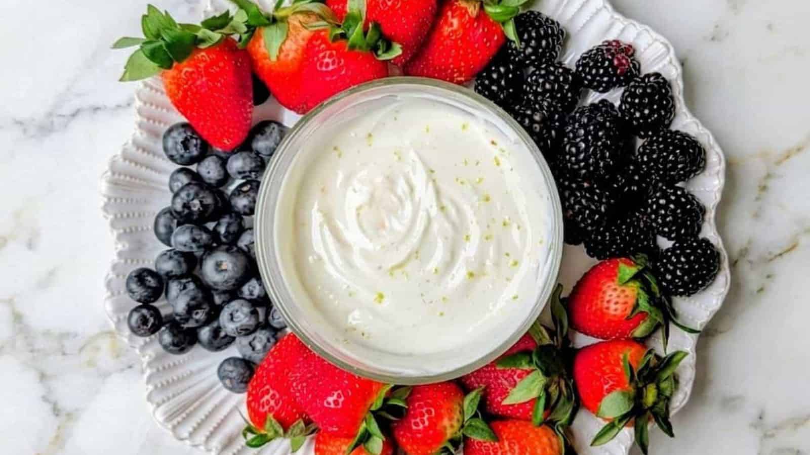 Greek yogurt fruit dip served creamy and smooth alongside fresh fruit.