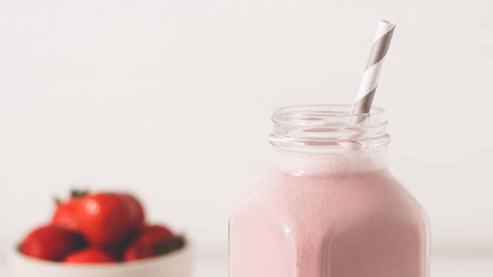 Strawberry shortcake smoothie blended creamy with fresh strawberries and a smooth, drinkable texture.