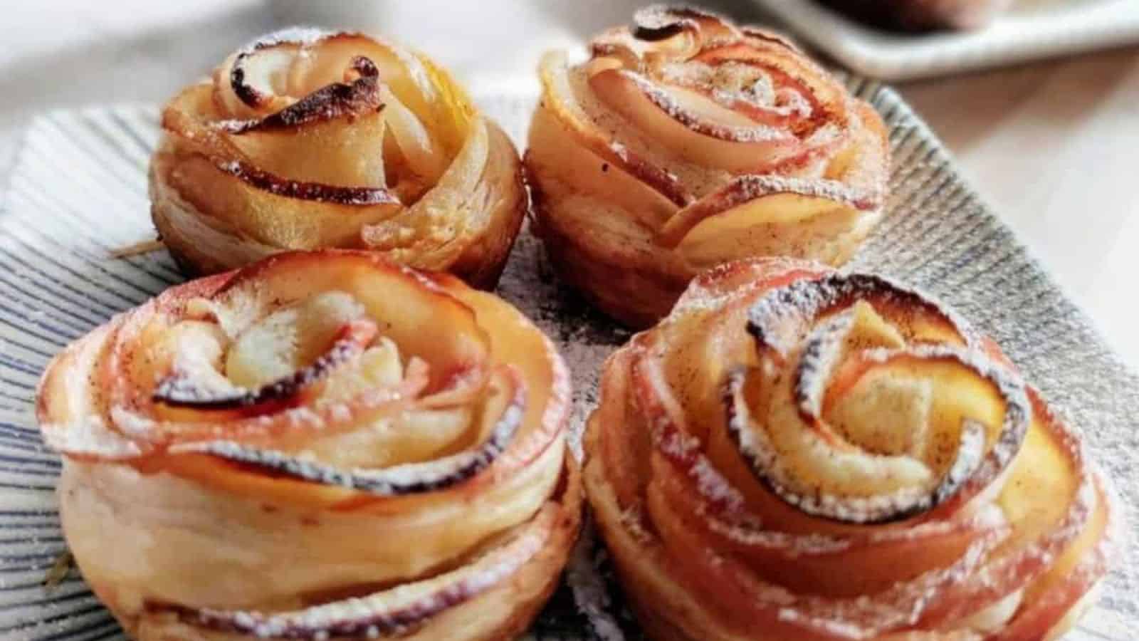 Baked apple roses made with thin apple slices wrapped in golden puff pastry.
