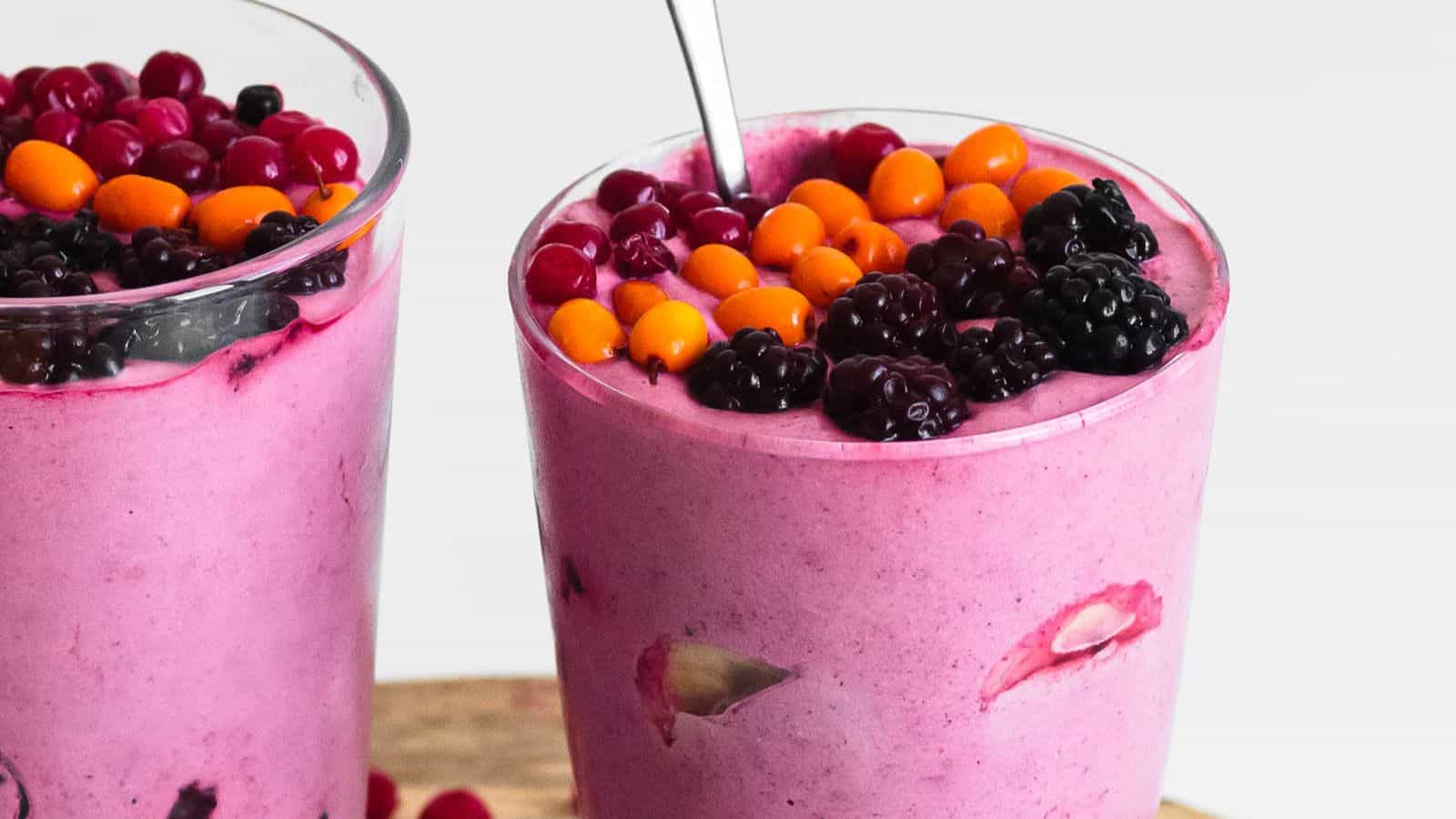 Berry banana milkshake blended smooth with a creamy texture and vibrant color.