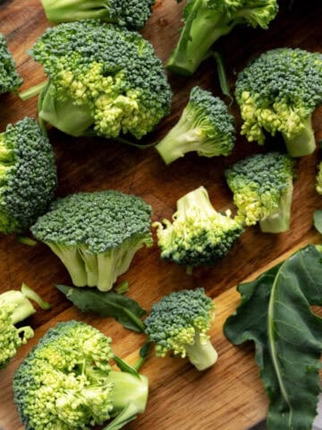 Chopped broccoli florets on a cutting board, ready for cooking or meal prep.