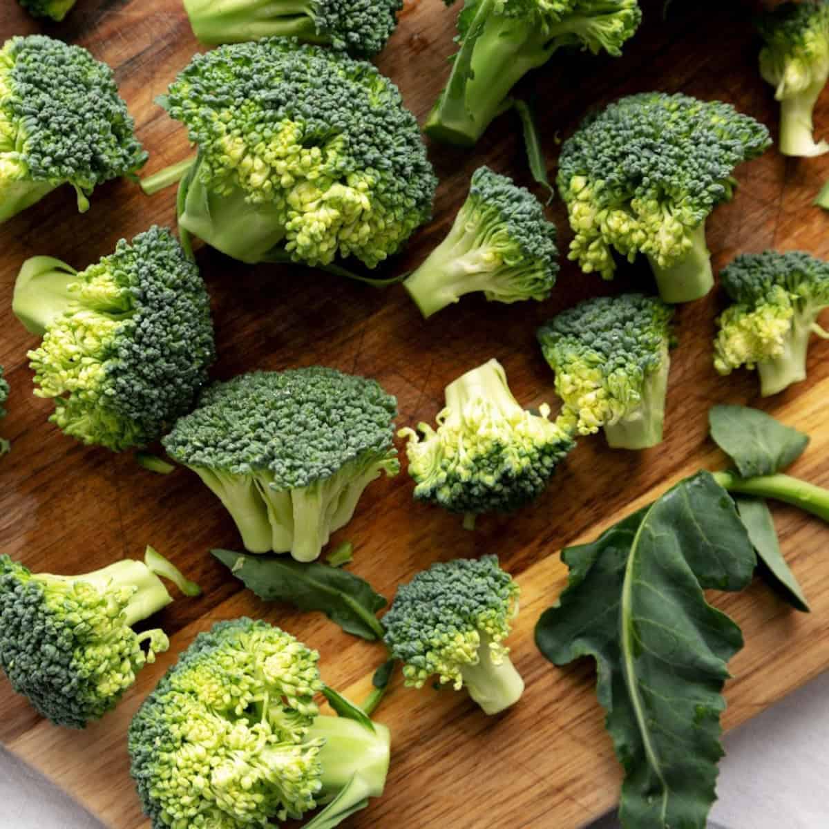 Chopped broccoli florets on a cutting board, ready for cooking or meal prep.