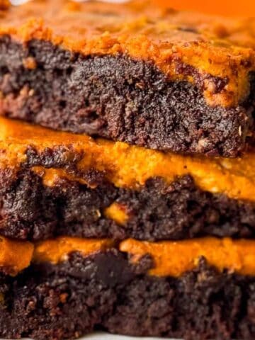 Pumpkin Cheesecake Brownies on a plate.