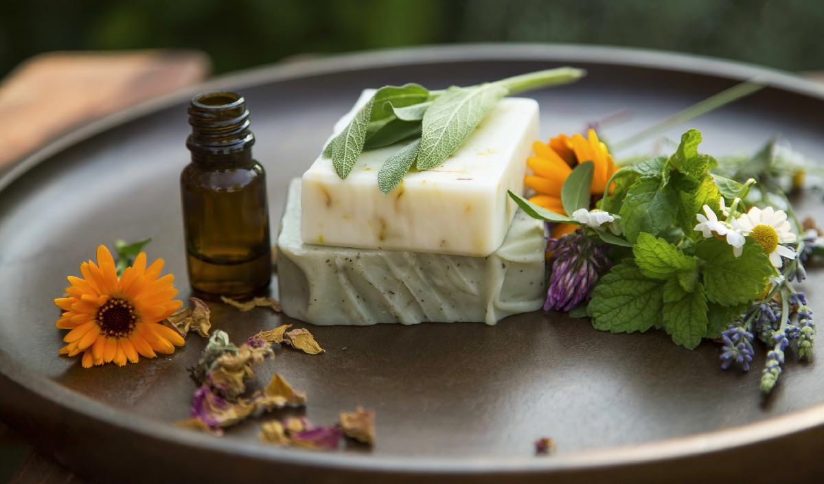 Handcrafted vegan soap with herbs and flowers, representing natural and cruelty-free skincare.