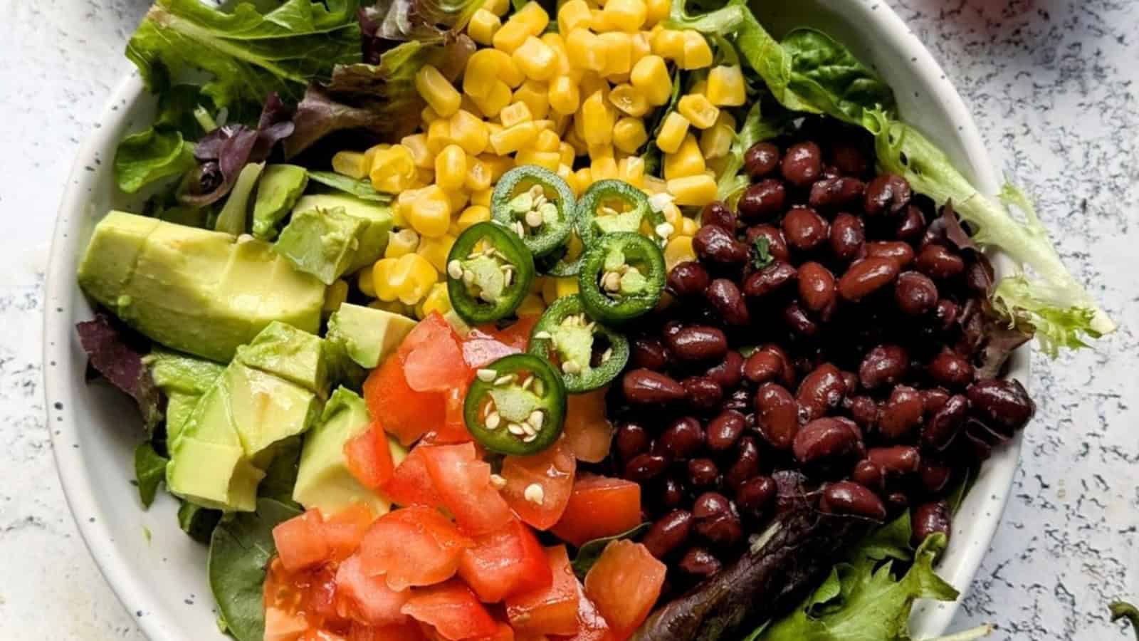 Bean and corn salad tossed with avocado and fresh vegetables.
