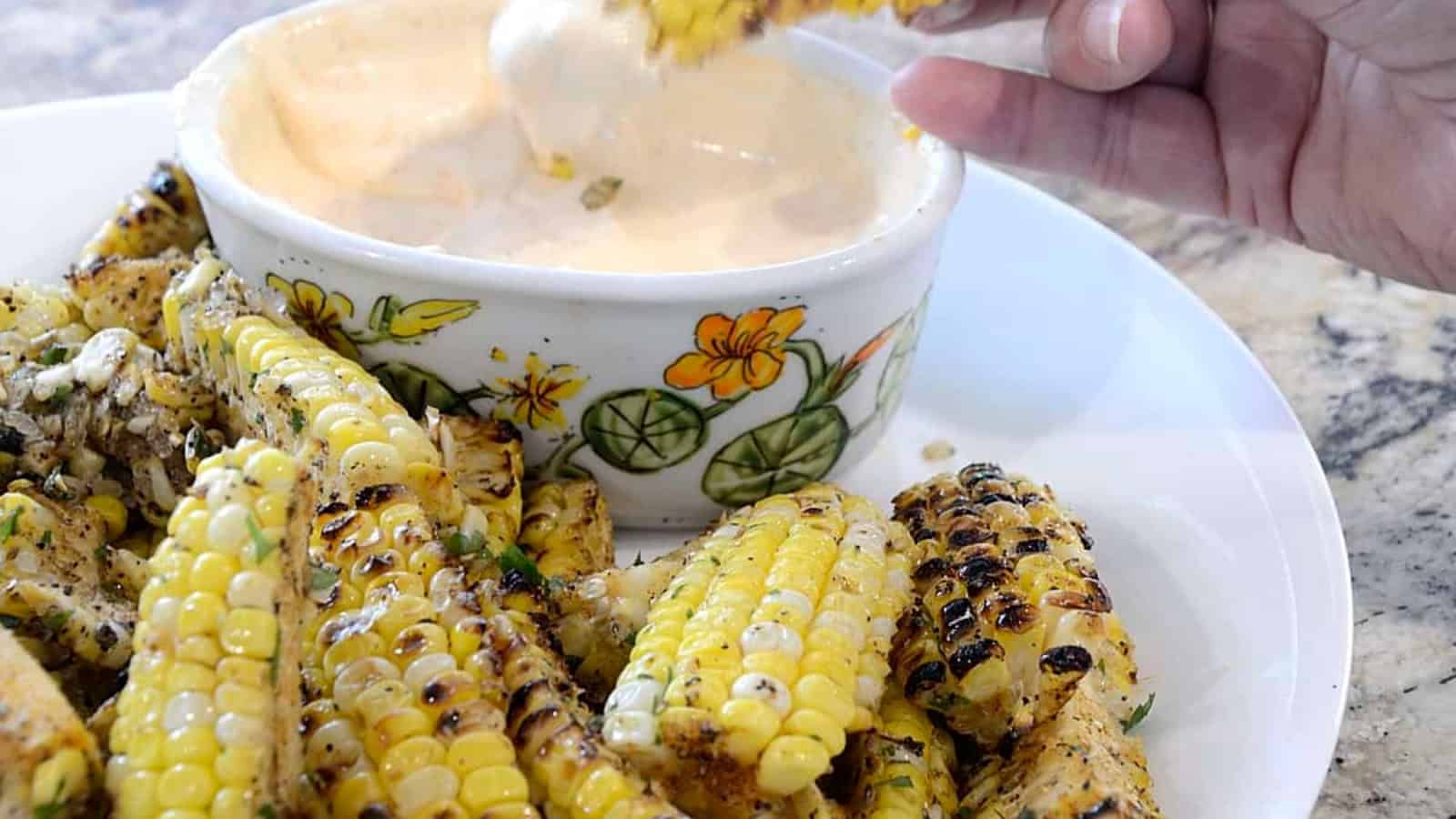 Corn ribs roasted or grilled with BBQ seasoning and charred edges.