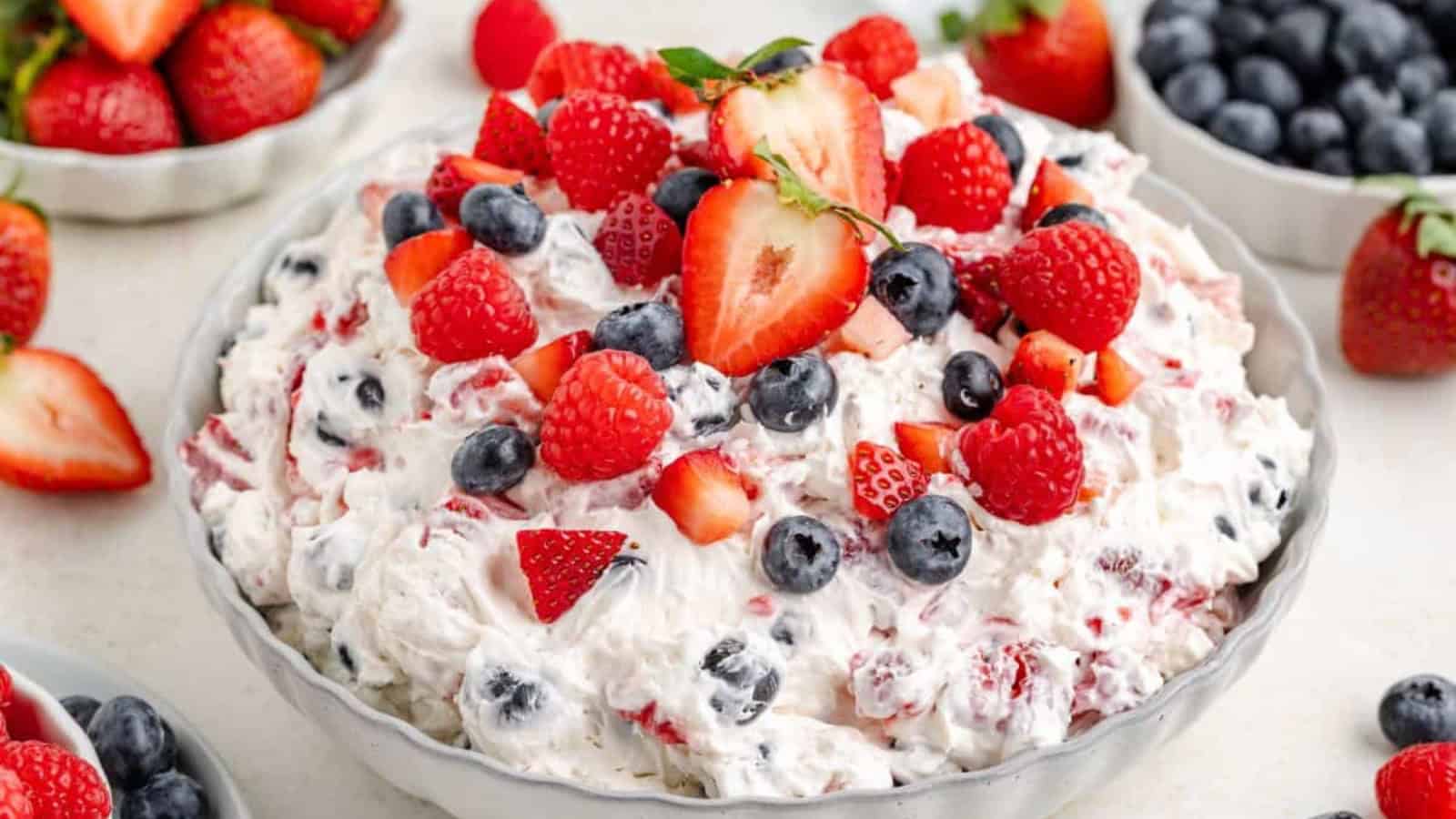 Cheesecake salad mixed with berries and creamy filling.
