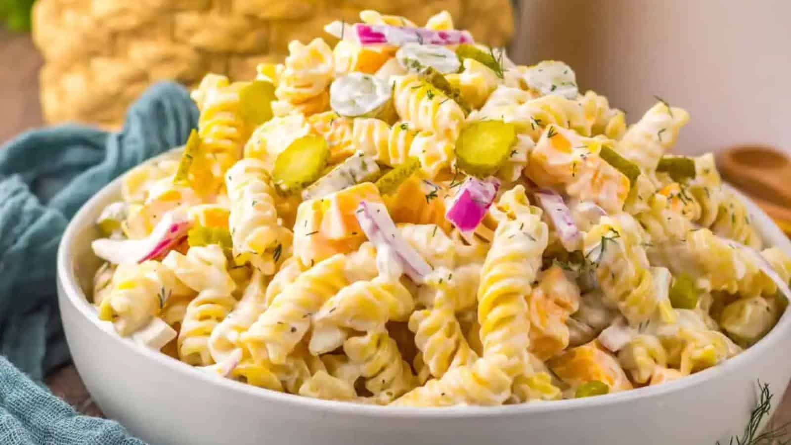 Pasta salad mixed with pickles and creamy tangy dressing.