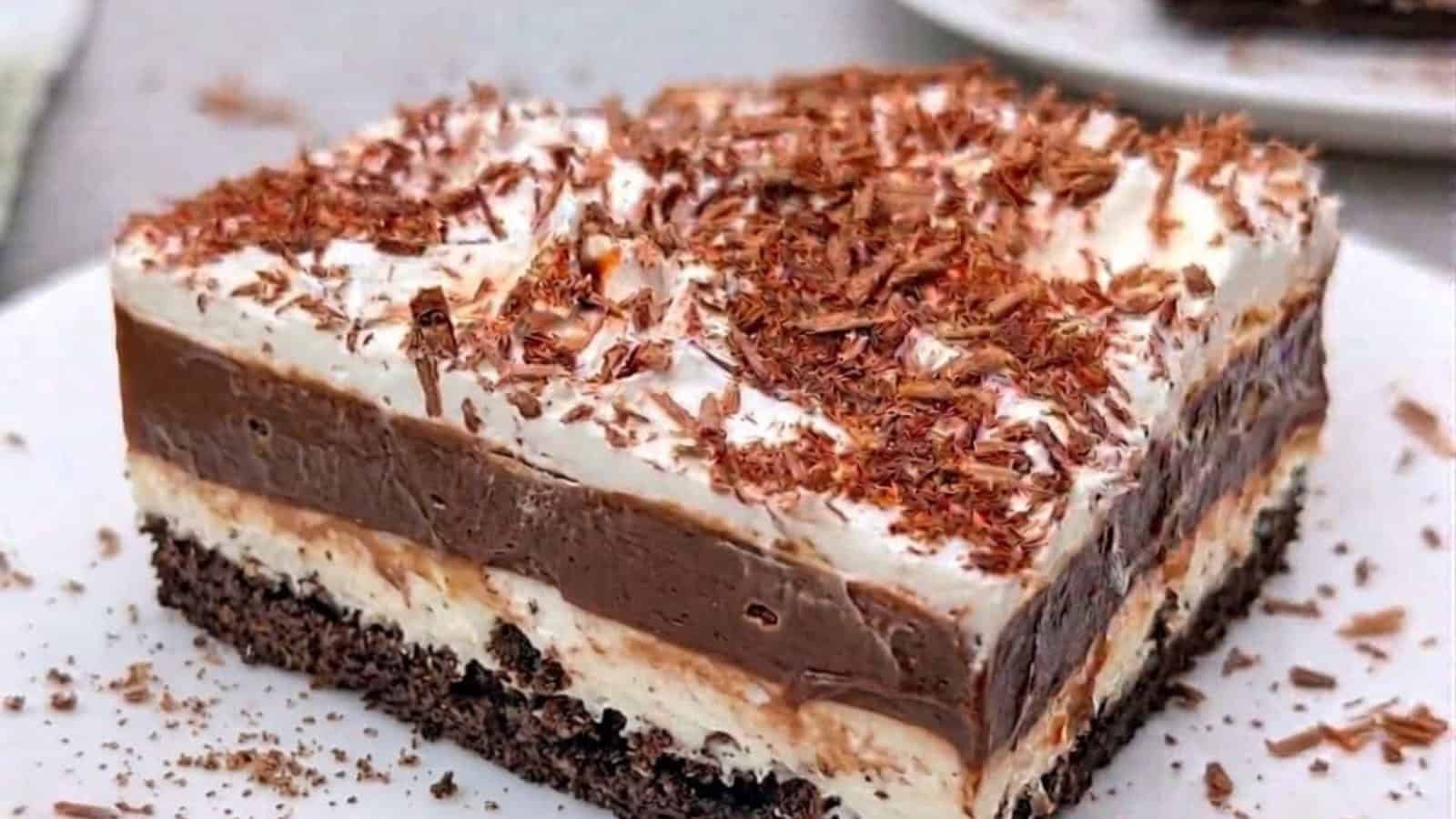Oreo lasagna layered with cookies, cream filling, and chocolate topping.