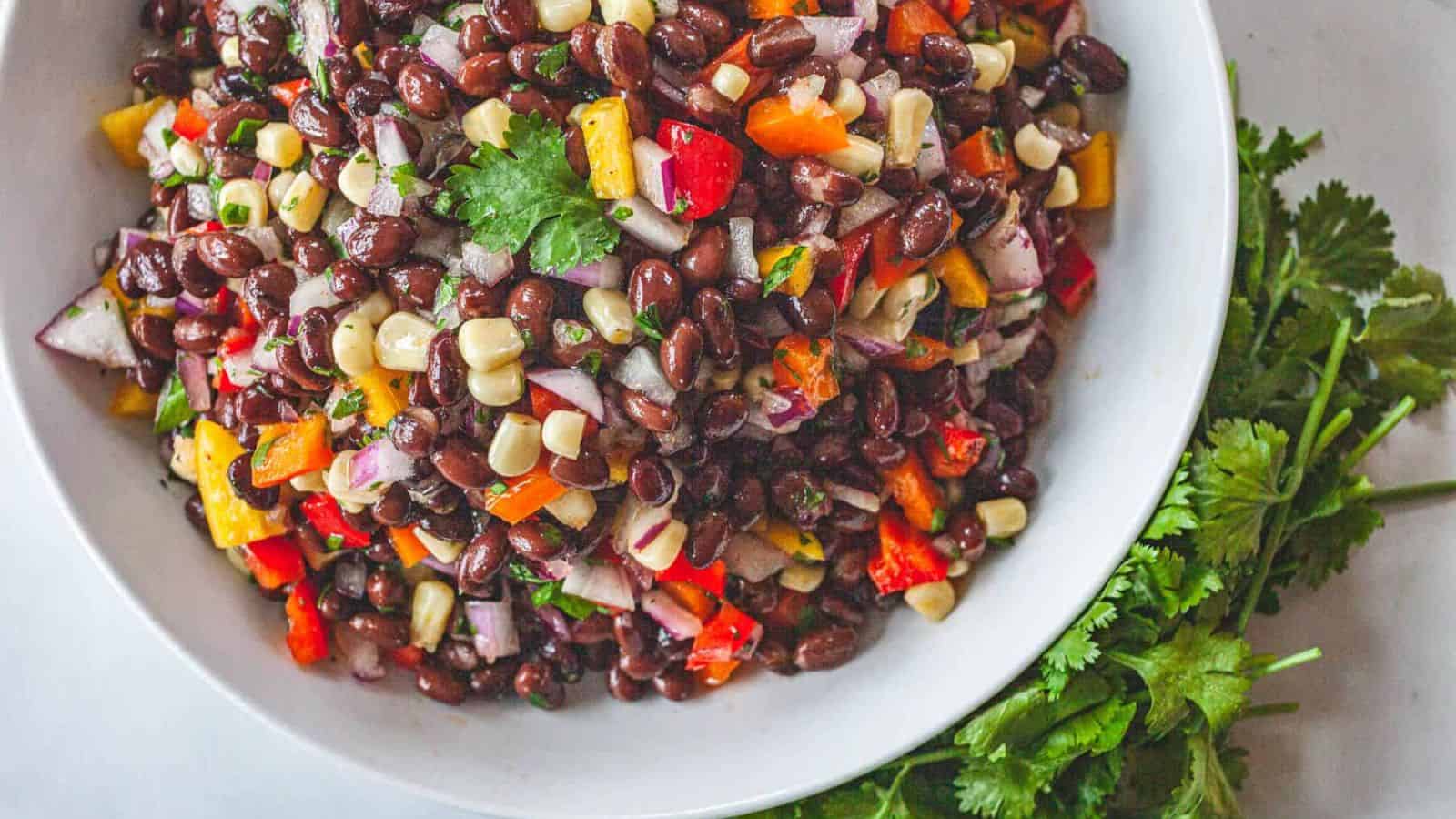 Black bean and corn salad mixed with fresh vegetables and tangy dressing.