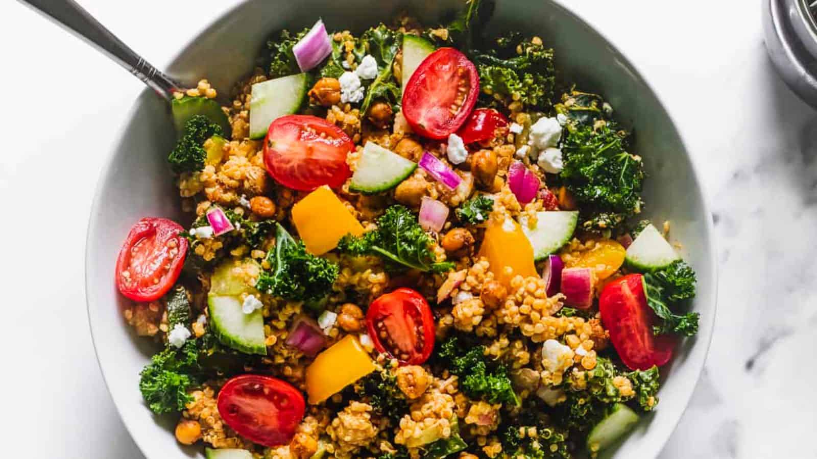 Quinoa salad tossed with chili lime seasoning and colorful vegetables.