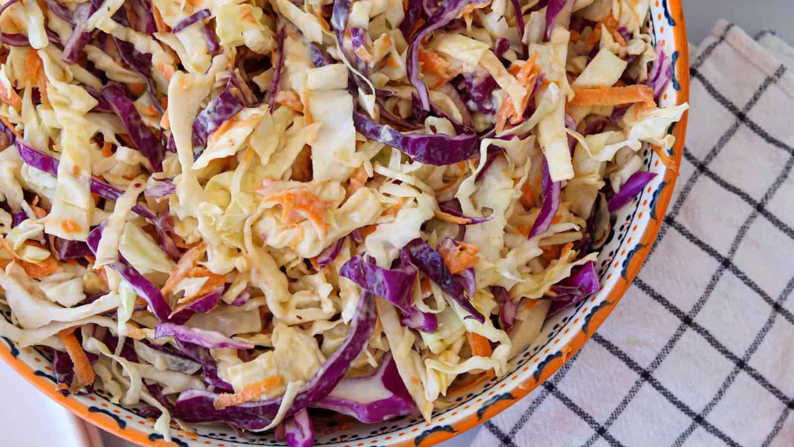 Coleslaw mixed with shredded cabbage and creamy dressing.