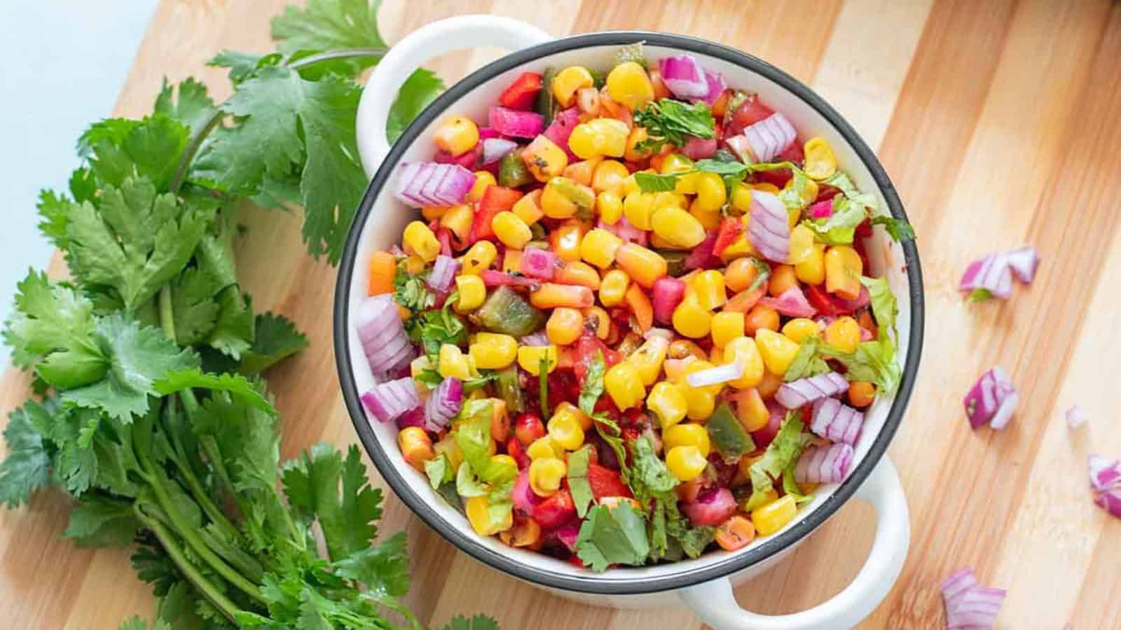 Corn salsa mixed with fresh corn, peppers, and herbs.