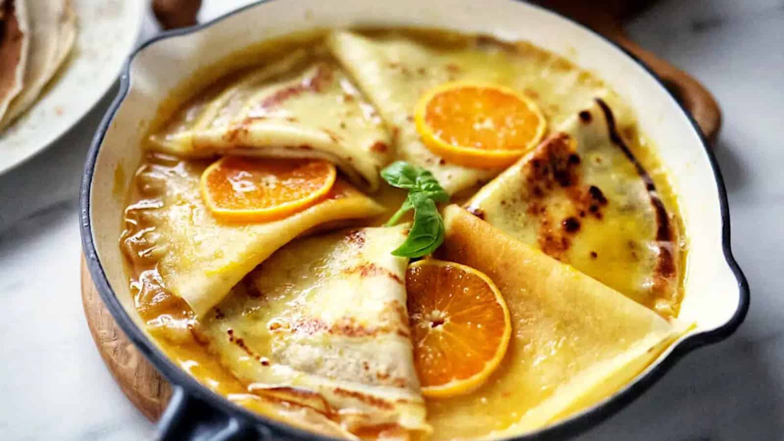 Cr&ecirc;pes served with orange butter sauce and caramelized citrus glaze.