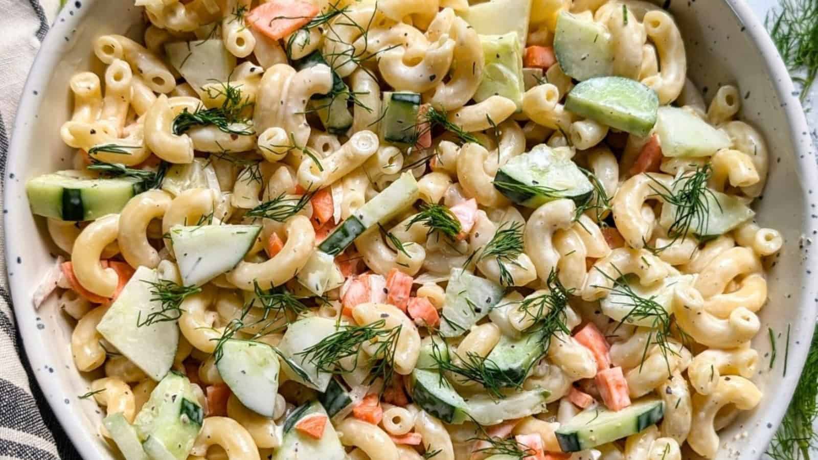 Macaroni salad mixed with cucumber, dill, and creamy dressing.