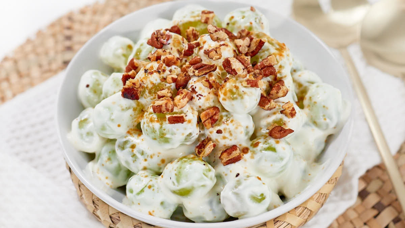 Grape salad mixed with creamy dressing and sweet grapes.