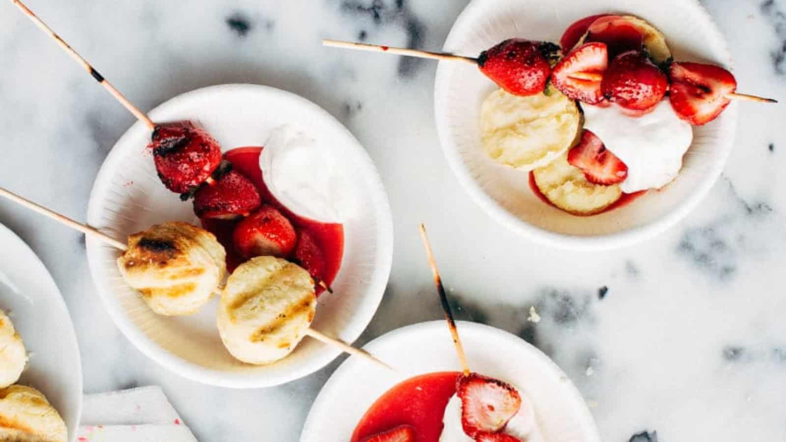 Strawberry shortcake topped with grilled strawberries and whipped cream.