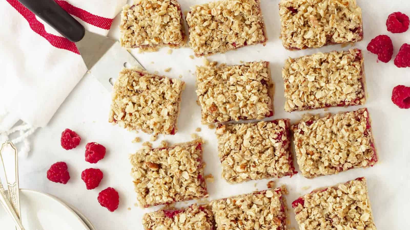 Raspberry bars layered with fruit filling and crumb topping.