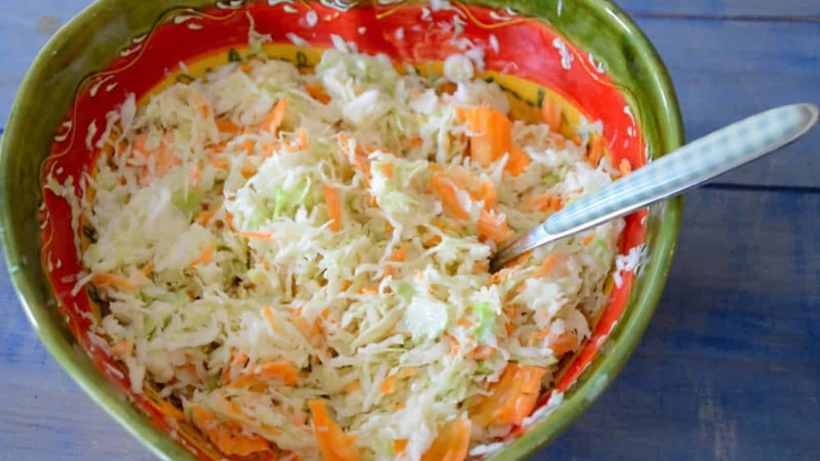 Creamy coleslaw mixed with shredded cabbage and tangy dressing.