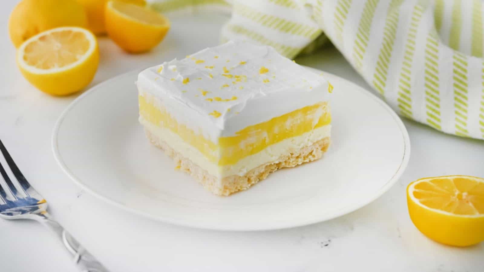 Lemon lush dessert layered with creamy filling and citrus flavor.