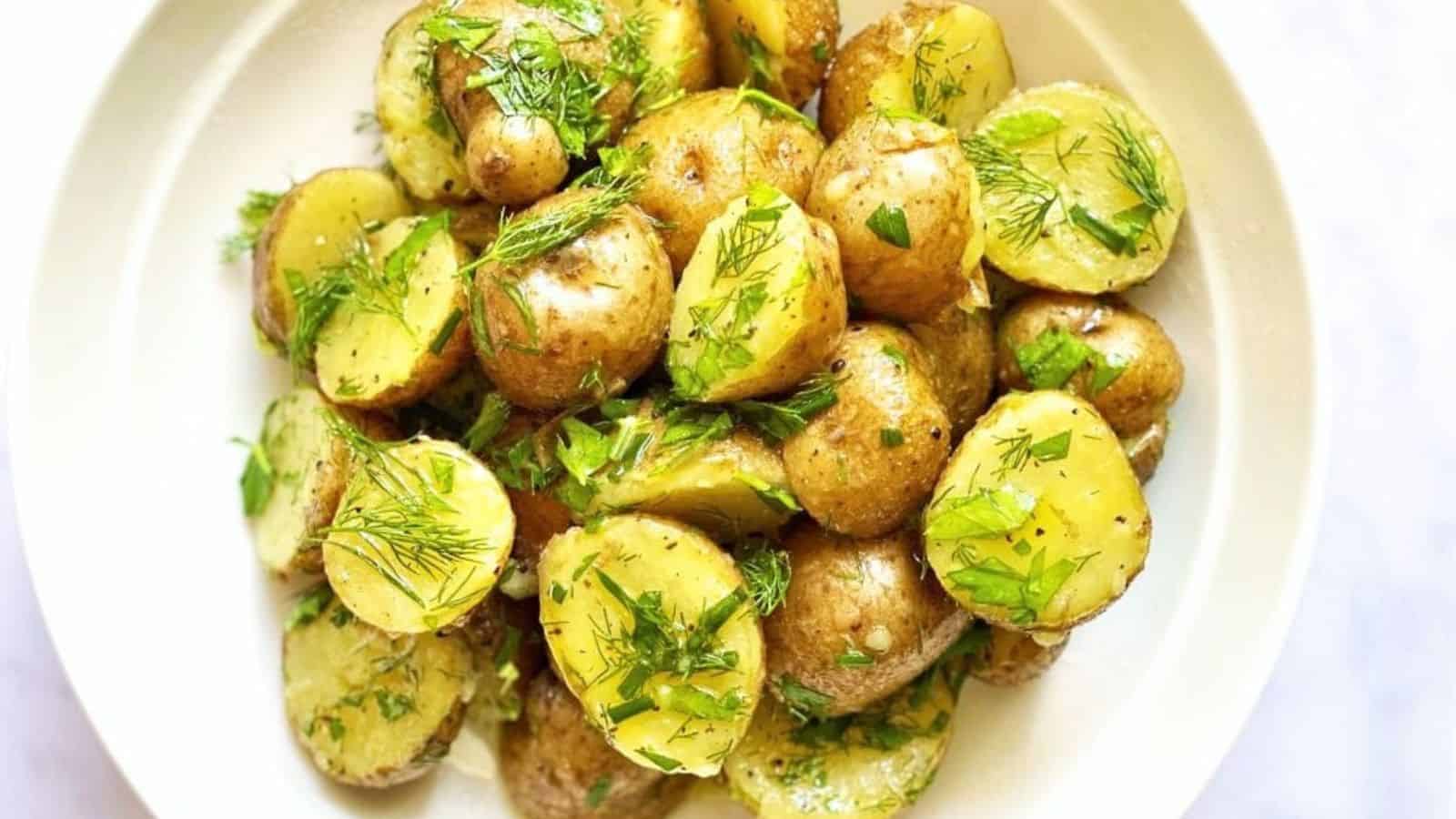 Vegan potato salad tossed with creamy dressing and tender potato chunks.