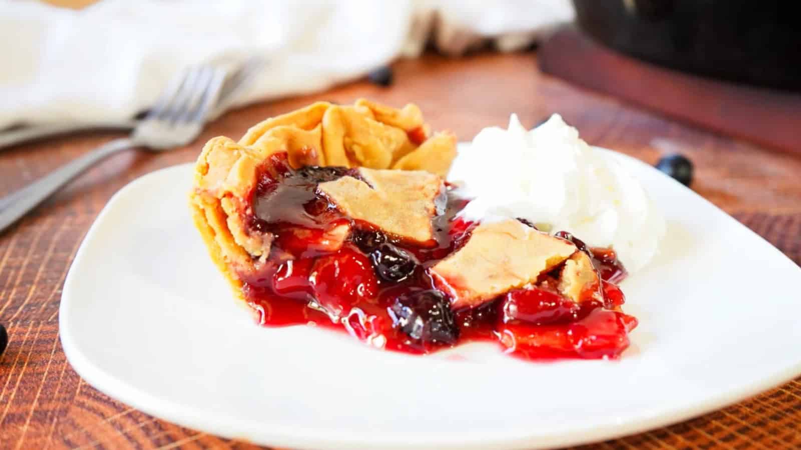 Cherry pie baked with mixed berries and golden crust.