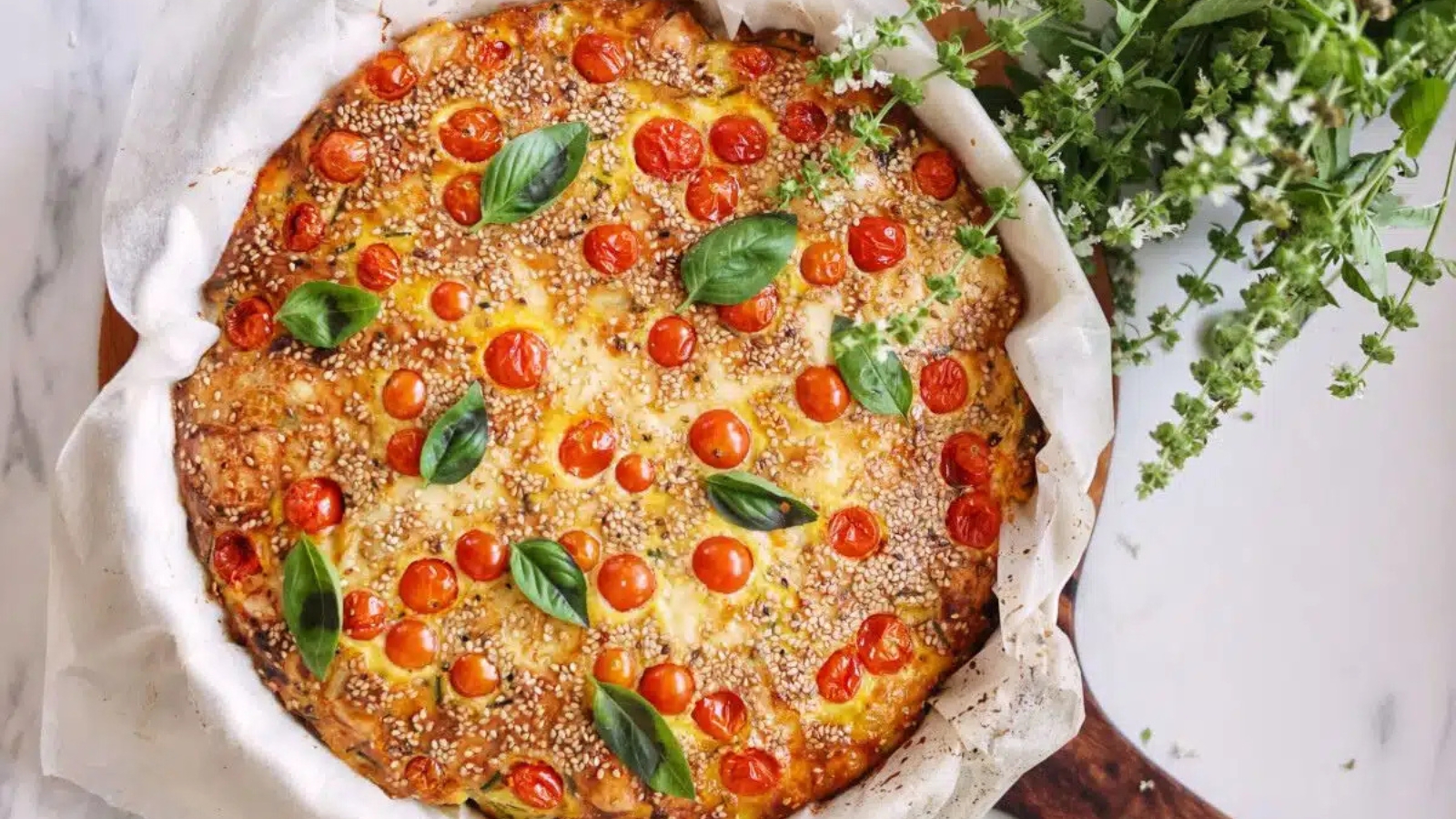 Spanish tortilla cooked with tomatoes and chickpeas until golden.