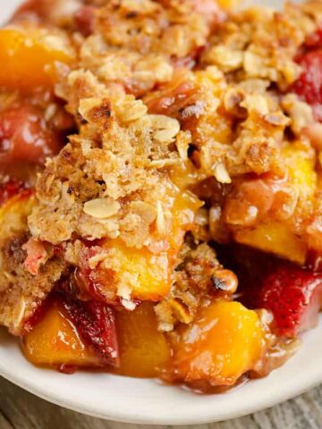 Strawberry Peach Crisp on a white plate.