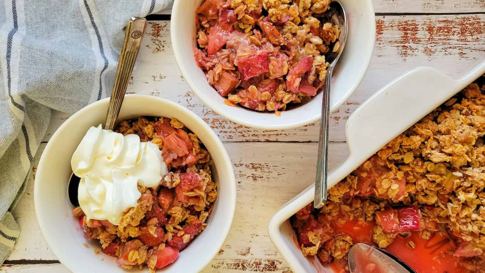 Strawberry rhubarb crisp baked with fruit filling and crumb topping.