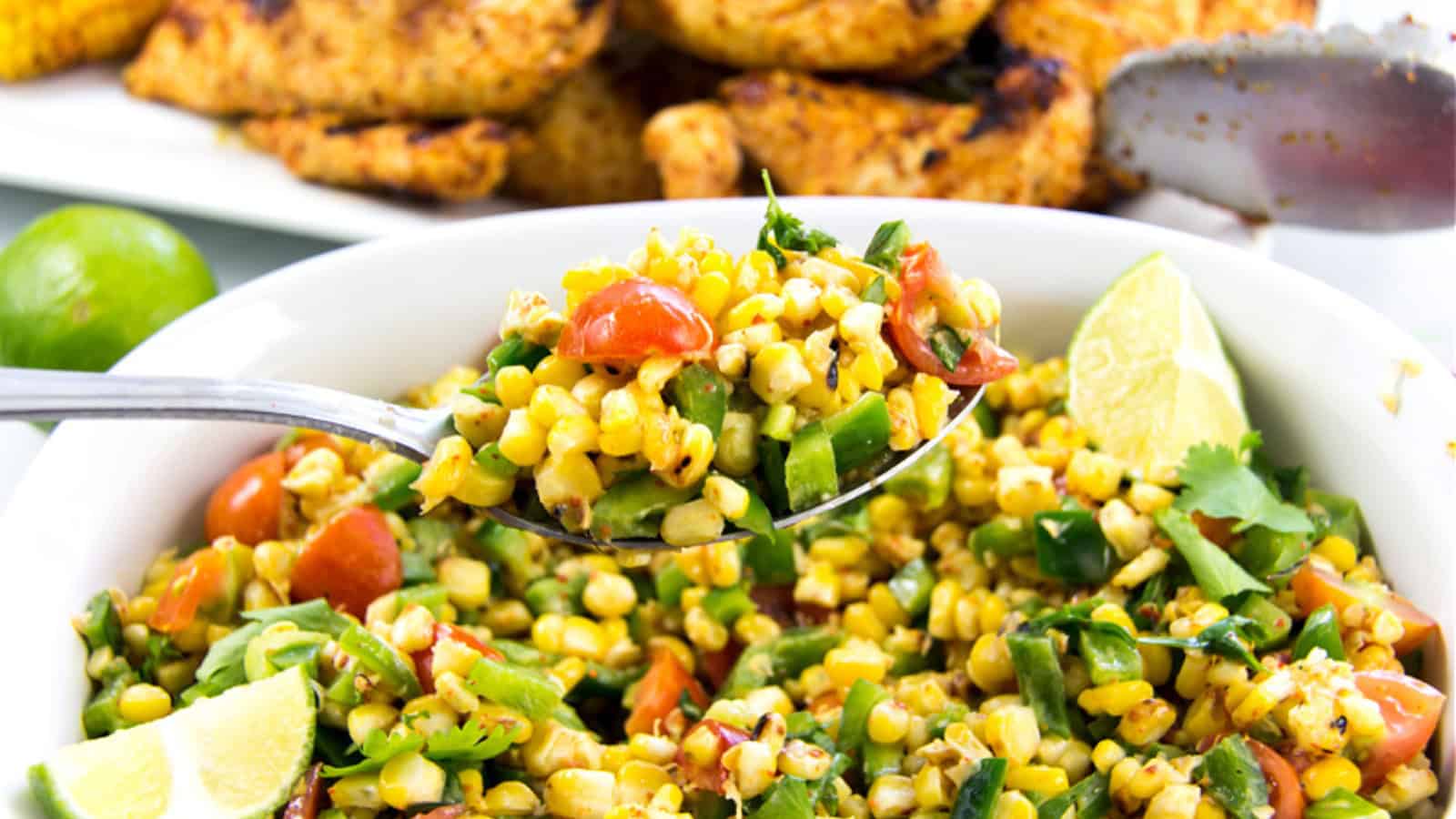 Corn salad mixed with creamy dressing and Mexican-style seasoning.