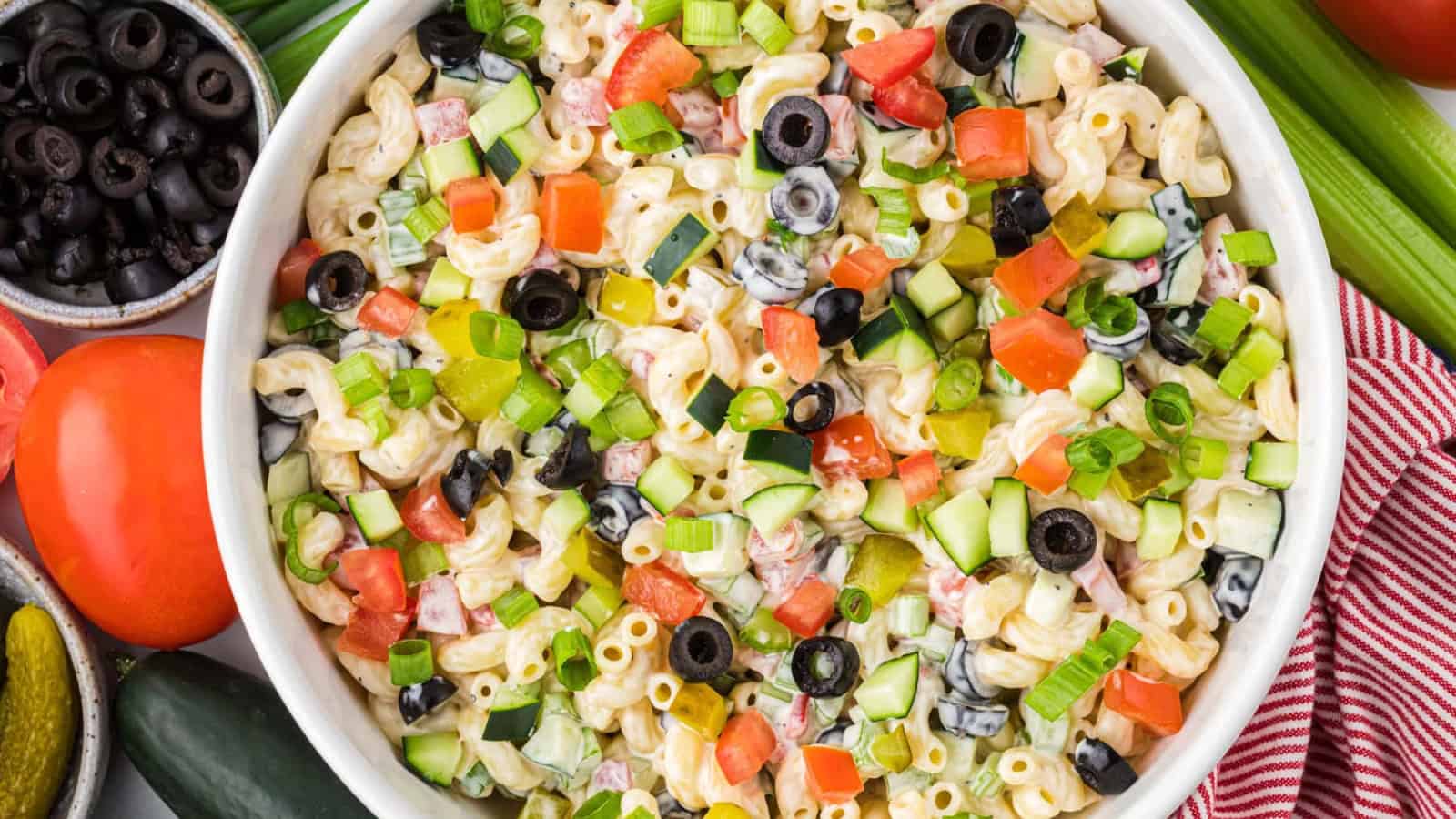 Macaroni salad tossed with mixed vegetables and creamy dressing.