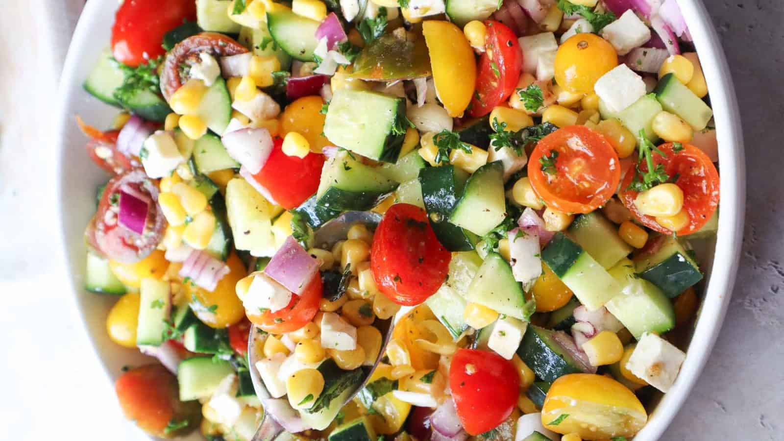 Tomato corn cucumber salad filled with fresh summer vegetables.