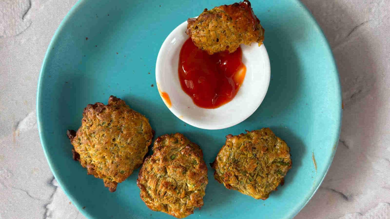 Crispy cucumber fritters cooked until golden in the air fryer.