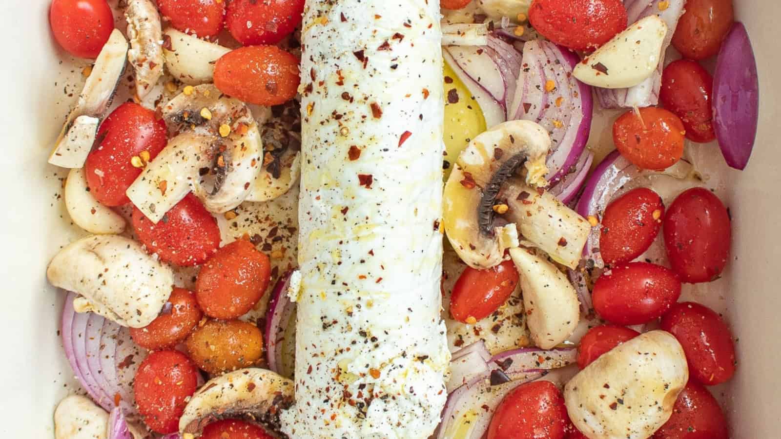 Baked goat cheese pasta with roasted tomatoes and a creamy sauce.