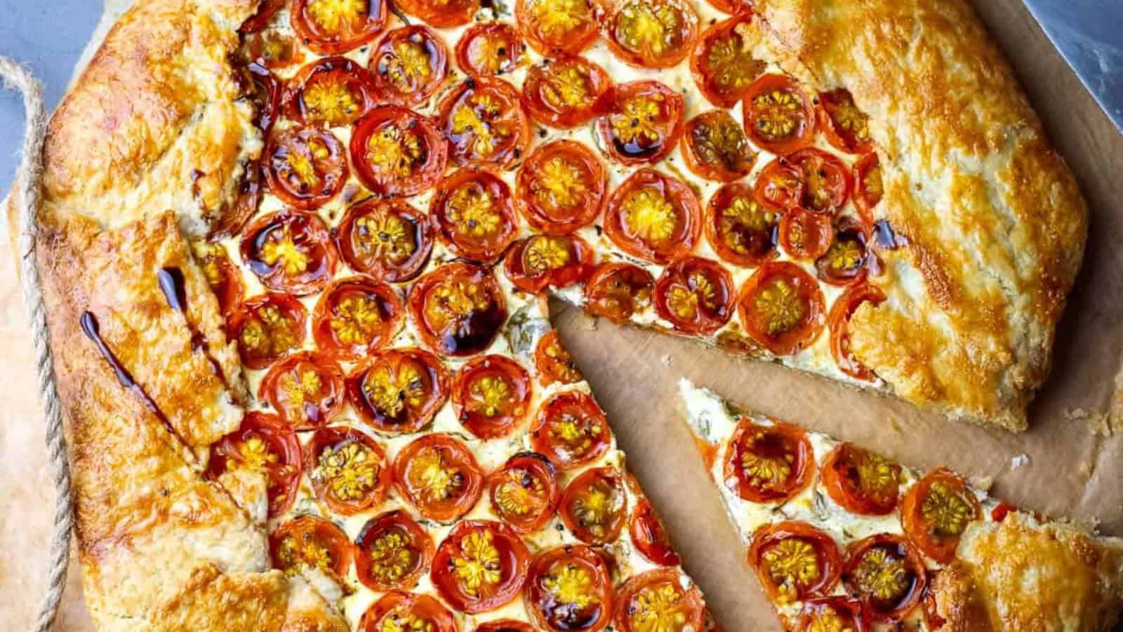 Rustic sourdough galette filled with cherry tomatoes and herbs.